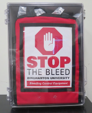 Wall cabinets stocked with eight Stop the Bleed kits