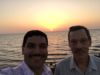 Ron Miles and Mohammad Younis in Saudi Arabia at sunset