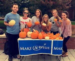 Wishmakers on Campus sell pumpkins to raise money and awareness for the Make a Wish Foundation.