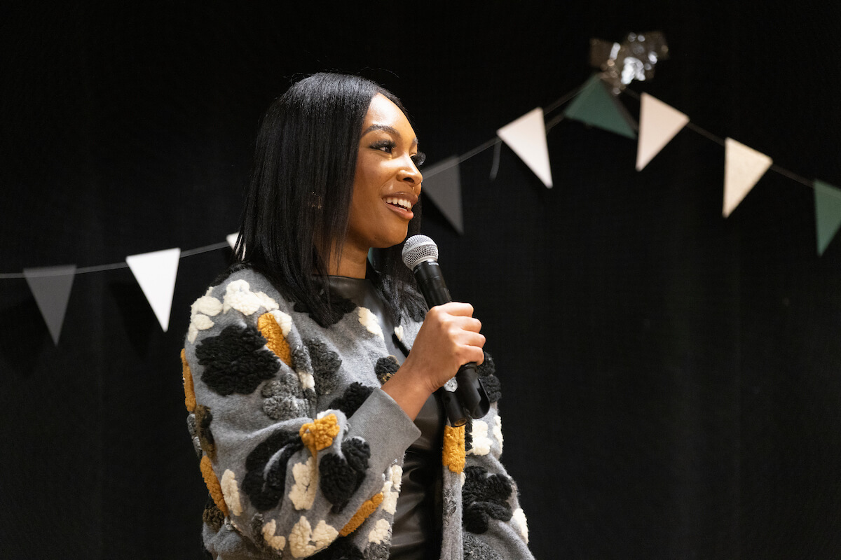 A professional female speaking to an audience.