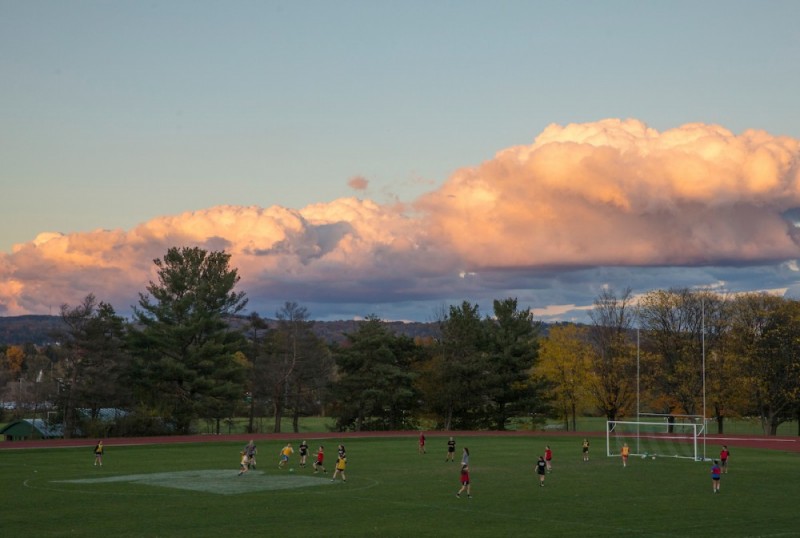 A beautiful sky is the backdrop of a 2017 intramural soccer game at the East Gym