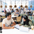 An image of two Binghamton students in Hinman Dining Hall.