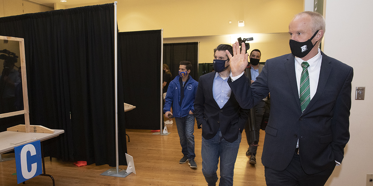 President Harvey Stenger is accompanied by SUNY Chancellor Jim Malatras for a tour of Binghamton University's Vaccination Clinic and Surveillance Test Center on April 9.