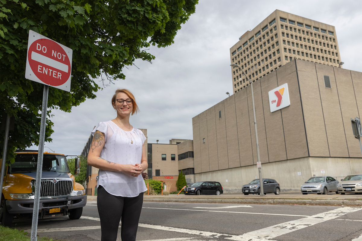 Harpur College of Arts and Sciences undergraduate Stephanie Karluk, who is studying pschology, photographed outside the YMCA in the City of Binghamton, May 25, 2022.