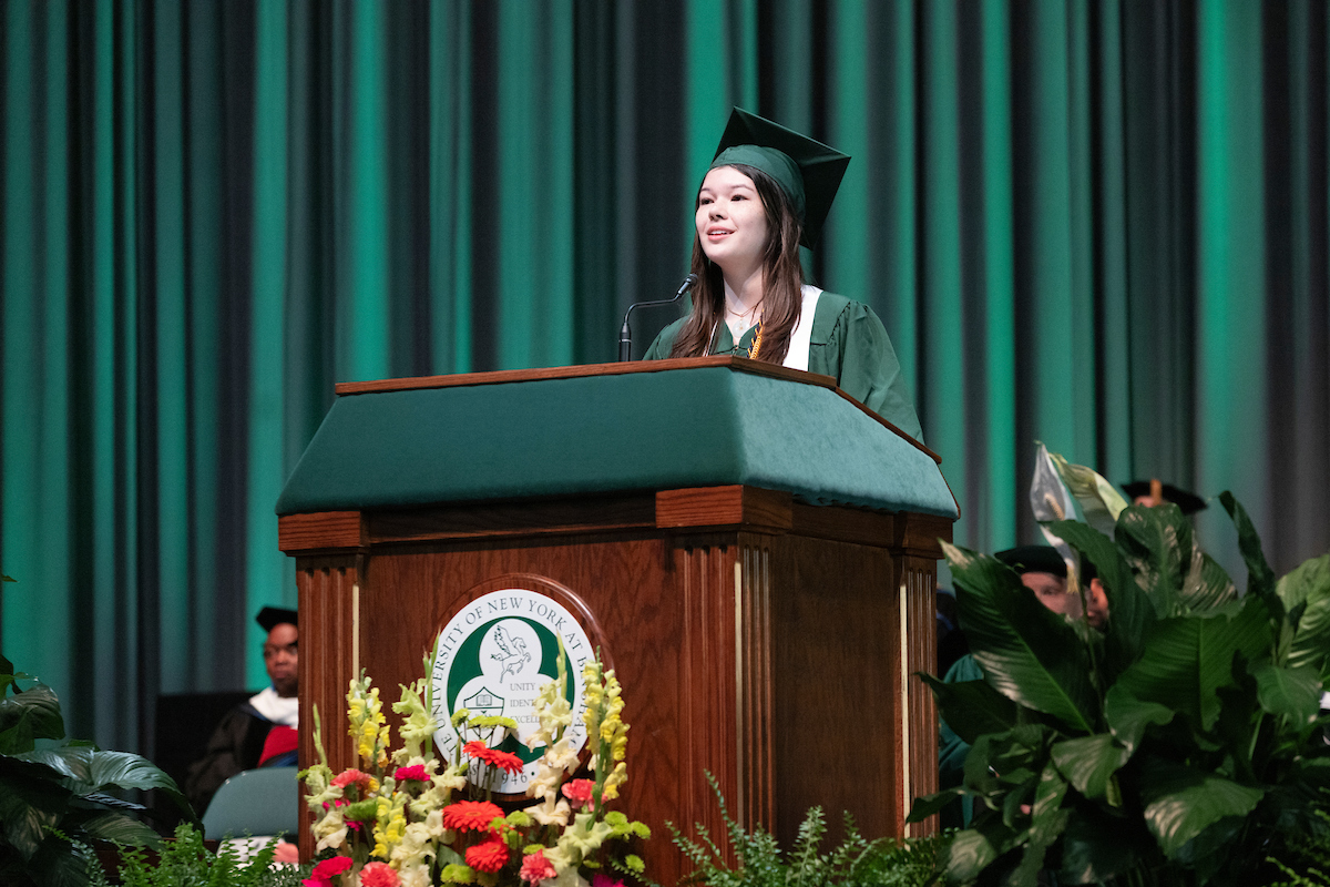 Rachel Dempsey, the student speaker for the first Harpur Commencement ceremony of the day, addresses her classmates on May 11.