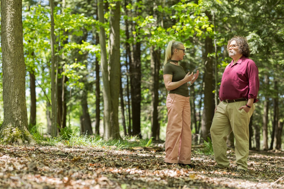 Professor of English, General Literature and Rhetoric Leslie Heywood and Associate Professor of Economics Andreas Pape in the Binghamton University Nature Preserve.