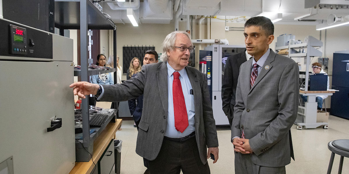 Nobel laureate M. Stanley Whittingham (left) speaks with Erwin Gianchandani, NSF assistant director of the Technology, Innovation and Partnerships (TIP) Directorate, during a summer laboratory tour at Binghamton University.