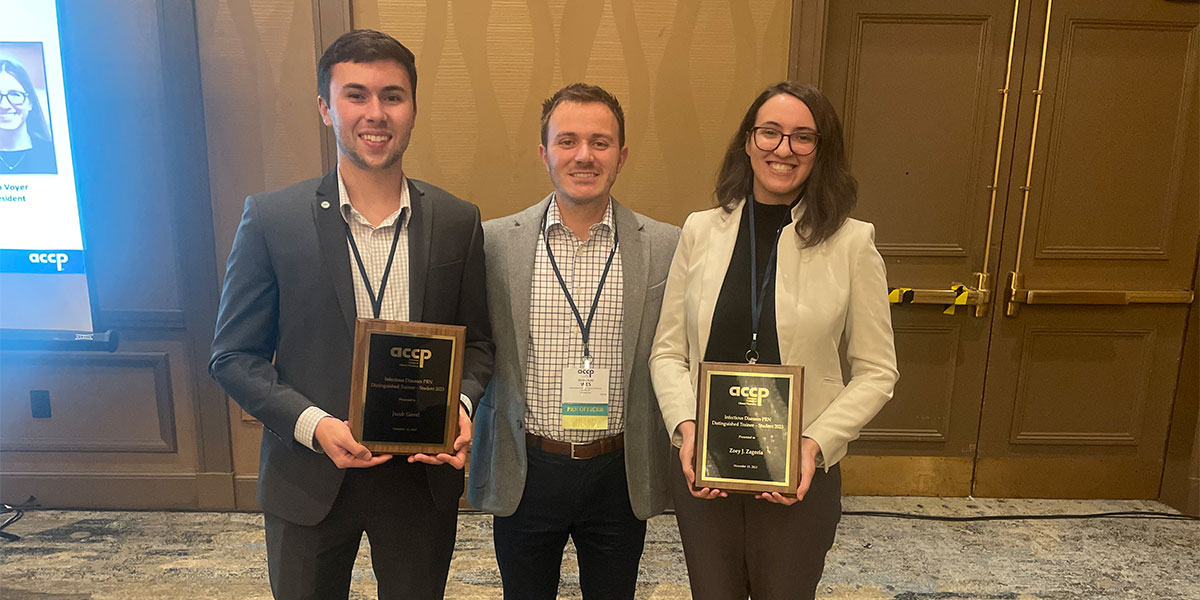 Jacob Govel '25, Wes Kufel, and Zoey Zagoria '24 pose after receiving ACCP awards for their research