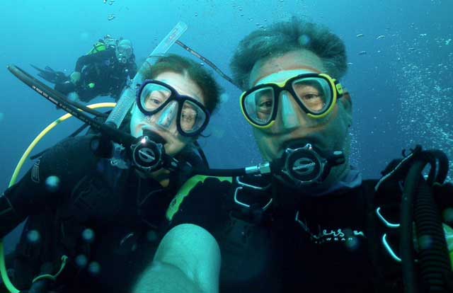 Health and Wellness Instructor Bob Hamilton dives with a friend in Bonaire, his favorite diving location in the Caribbean.