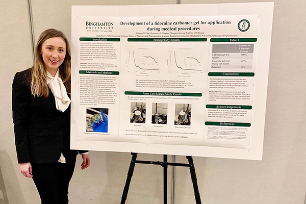 Binghamton University School of Pharmacy and Pharmaceutical Sciences P3 student Brianna Flint with her winning research poster.