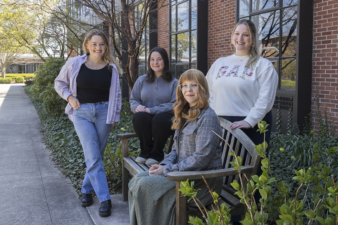 Melissa Haller, front, coordinator of the digital and data studies program, with students Kajsa Kenney, left, Julia Gnad, center, and Brianna Sexton.