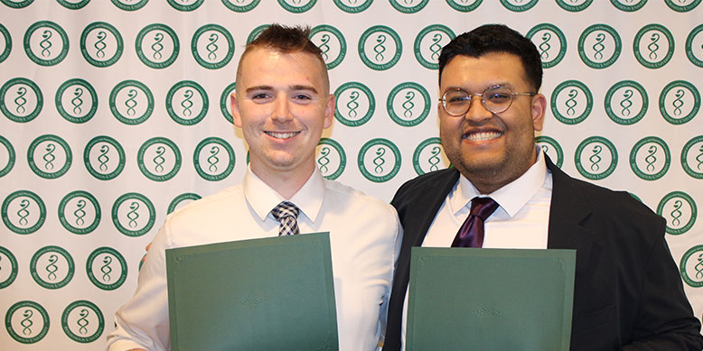 Brendyn Savage, PharmD '24, left, and Eshraq Islam, PharmD '24, right, with their SOPPS Professionalism awards