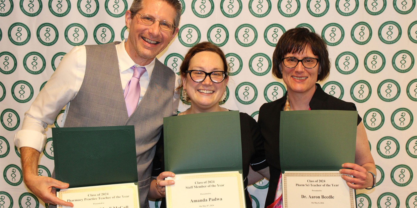 Clinical Professor Kenneth McCall (left), Administrative Coordinator Amanda Padwa (center) and Associate Professor Aaron Beedle (right) with their Pharmacy Practice Teacher of the Year, Staff Member of the Year and Pharm Sci Teacher of the Year awards respectively