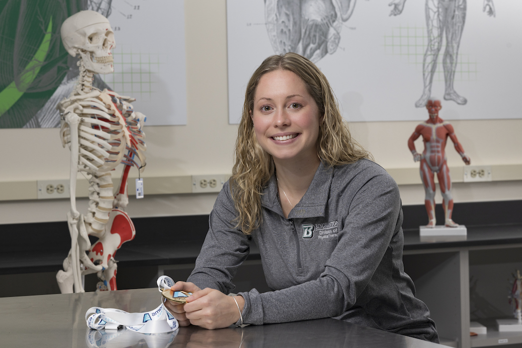 Sophia Howard ’21, a student of Decker’s Doctor of Physical Therapy program, holds a diving medal from her undergraduate career.