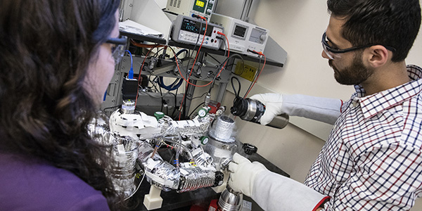 Binghamton University's engineering programs jumped 32 places into the top 100 of 'U.S. News & World Report's' Best Graduate Schools 2020 publication. Here, students of Assistant Professor of Mechanical Engineering Scott Schiffres work in a lab in the Engineering and Science Building at the Innovative Technologies Complex.