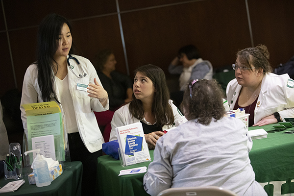 Binghamton University School of Pharmacy and Pharmaceutical Sciences students at a healthcare clinics for members of the community.