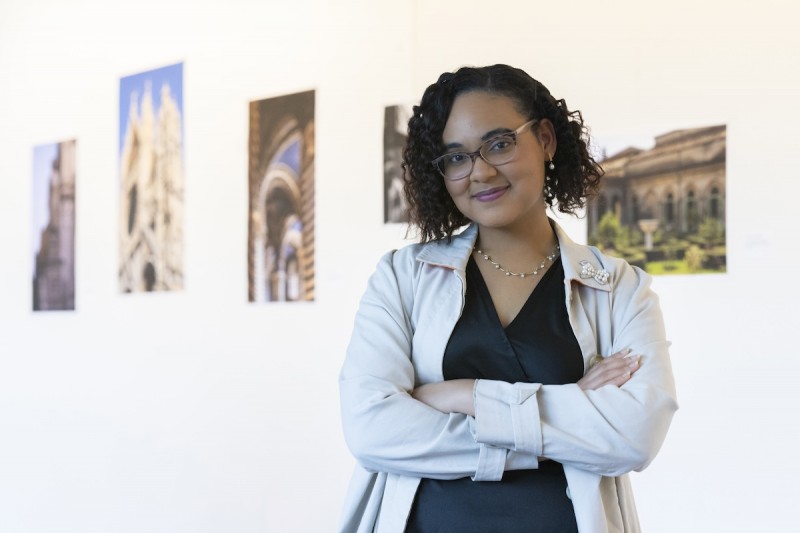 Gabriela Garcia is pictured here with her exhibition, Briefly Passing By, in the background. The exhibition is presented in the Anderson Center’s Grand Corridor with the invaluable support of the Gilman International Scholarship Program, Binghamton's Office of International Education & Global Initiatives (IEGI), the Arts and Design Department and TRIO SSS.