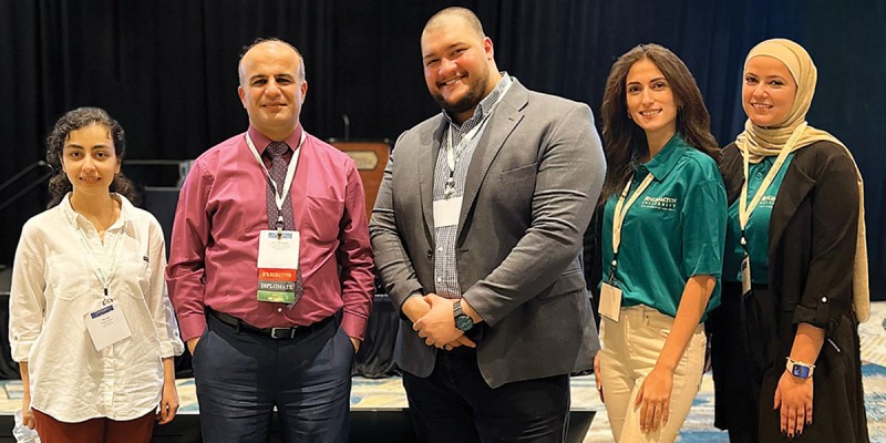 At the HSPIC conference, left to right: Maryam Hosseini, Distinguished Professor Mohammad Khasawneh, Ali Rawabdeh, Sarah Sawaqed, Lubna Tarawneh.