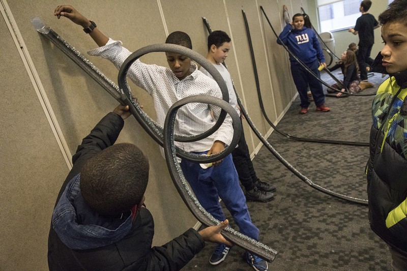 Binghamton East and West Middle-School students in the sixth grade learn basic science lessons from Watson School students during a STEM visit to the Engineering and Science Building at the Innovative Technologies Complex, Feb. 13, 2017.