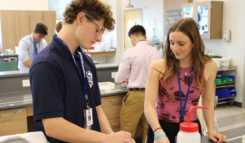 Two BOCES New Visions students practice compounding in the school's lab.