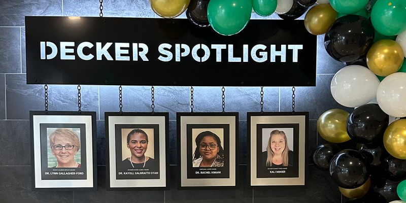 The Decker Spotlight display in the University's Health Sciences Building highlights this year's alumni award recipients: Lynn Gallagher-Ford, Kayoll Galbraith Gyan, Rachel Kimani and Kali Minier.