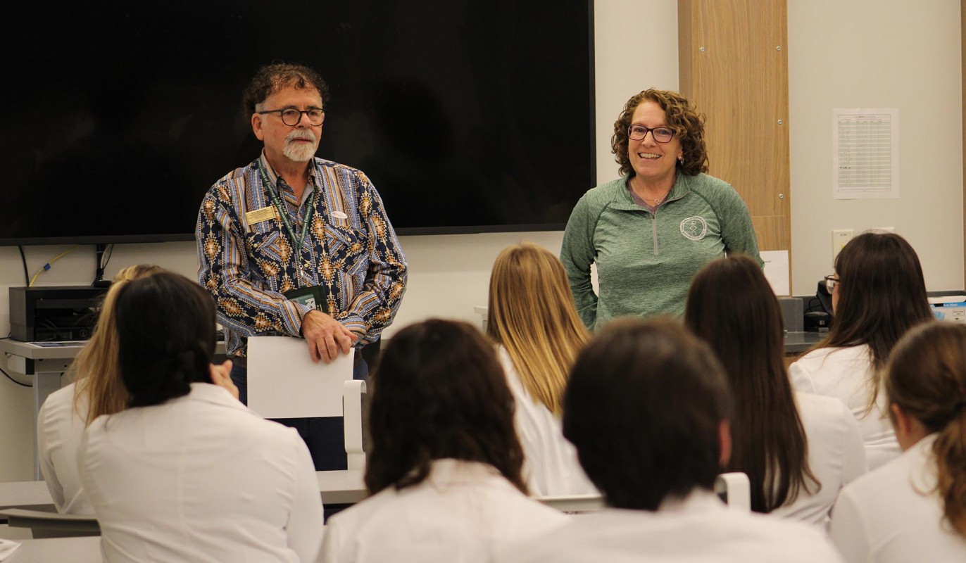 Eric Richards, the experiential education co-coordinator, and Jude DeLuca, the associate dean for academic and student affairs, answering questions from New Visions students.