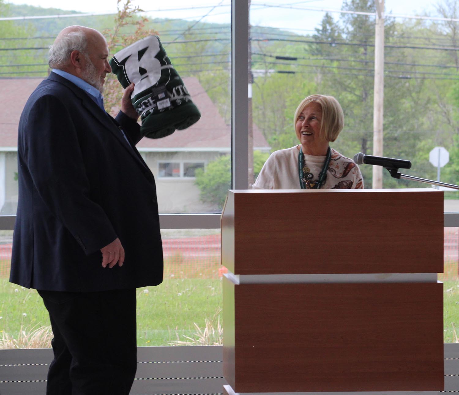 Associate Professor Harold Lewis accepts a parting gift from Instructional Support Assistant Bonnie Cornick at his retirement celebration earlier this year.