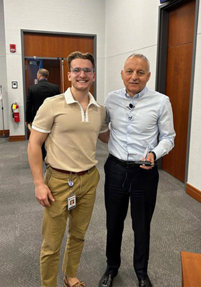 Erik Schalk '23 with Rolls-Royce CEO Tufan Erginbilgiç.