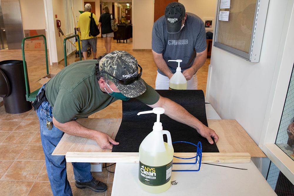 Installing hand sanitizer stations 