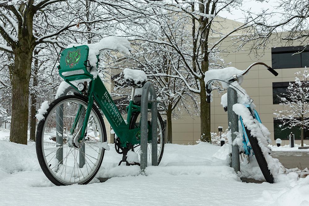 Snow-covered bicycles 