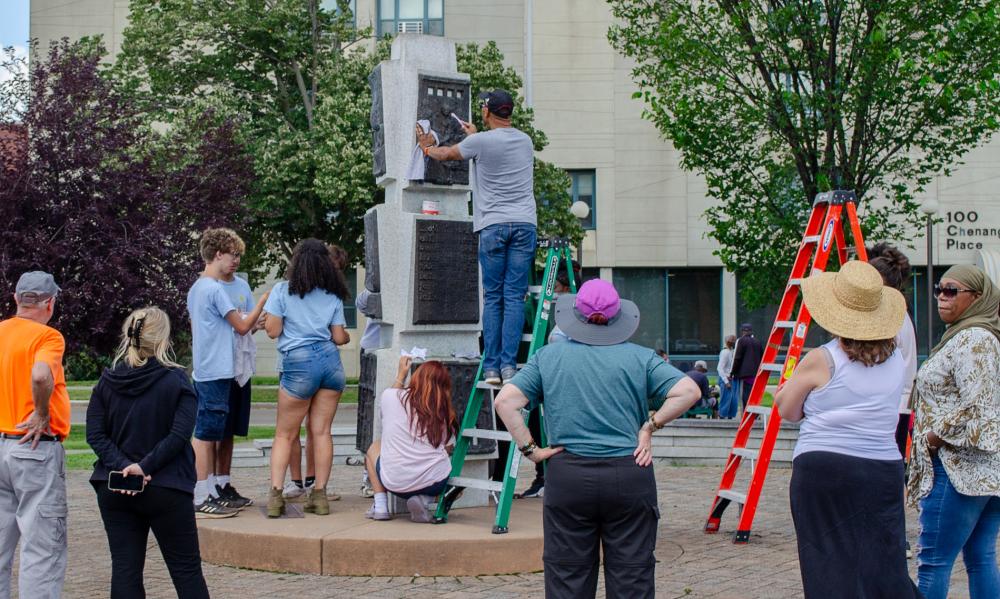 Cleaning the Ed Wilson sculpture 